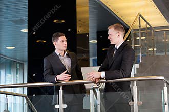Businessmen discussing at office