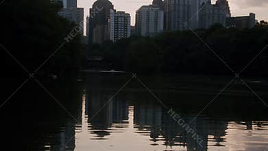 Shot of the reflection of Atlanta's skyscrapers transitioning to the actual skyscrapers.