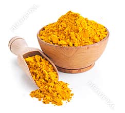 Ground turmeric isolated on white