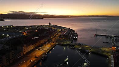 Drone view over Victoria Dock and old buildings line at sunrise in Hobart, Tasmania, Australia