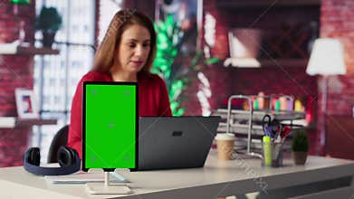 Woman organizing and planning activities on the agenda next to chroma key