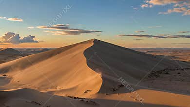Desert Sunset over Golden Sand Dunes
