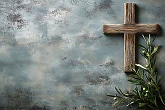 The wooden cross and olive branch serve as a representation of faith and hope