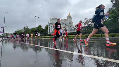 Athletes running Istanbul half marathon in historic street of Fener district