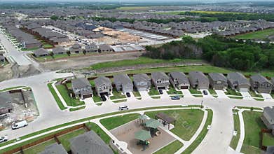 Master planned community northern edge of Highway 380 in Princeton, Texas with Lake Lavon in background, new construction houses