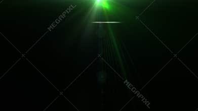 Glow green optical flare light burst on black background