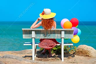 Woman with colored balloons