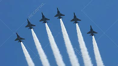 Planes Flying in Formation Against Clear Blue Sky Jets Aerobatics