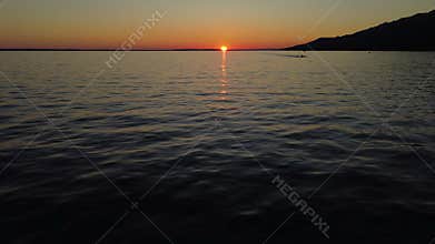 Peaceful panoramic view of the Adriatic coastline under soft golden light in Dalmatia, Croatia