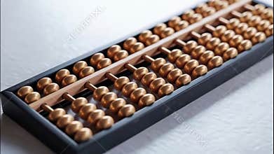 Antique-style Chinese abacus on clean white surface, detailed close-up