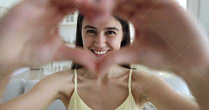 Changing portraits of diverse people showing to camera love symbol