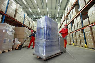Logistic - workers in storehouse