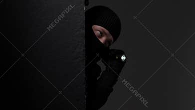 Person peeking with flashlight in dark environment