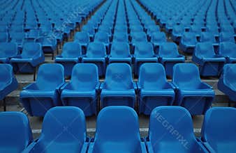 Rows of empty blue seats in stadium stands. Sport arena before game or after match. Perspective view of vacant seats. Architecture
