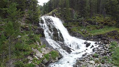 Cascade of a mountain stream (Aerial video shooting from a drone)