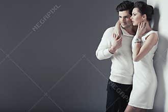 Smiling young lovers in casual pose