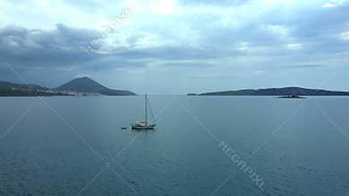 Aerial beach view with luxury yacht at blue sea