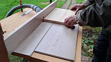 Homemade wood milling machine in the workshop. The craftsman processes wood manually.