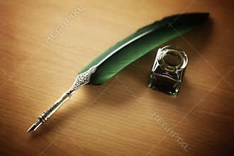 Quill pen and ink well on desk