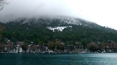 Snow on Mountain and Lake in Winter