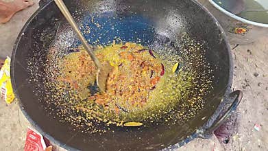 Traditional Indian Curry Cooking in Large Pan, Street Food Preparation and Spicy Cuisine Close Up