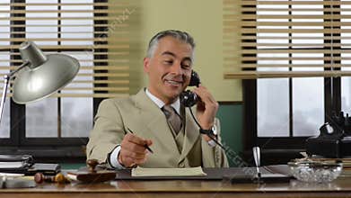 Confident vintage businessman working at desk
