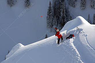 Ski patrol tossing hand charge