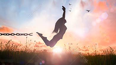 Silhouette Woman Breaking Chain and Jumping Toward Freedom at Sunrise