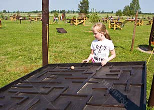 Girl and educational toy outdoors
