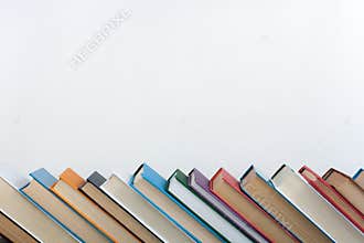 Stack of colorful books. Education background. Back to school. Book, hardback colorful books on wooden table. Education