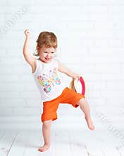 Happy beautiful baby girl dancer dancing hip hop dance