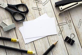 Business cards, pens and office supplies