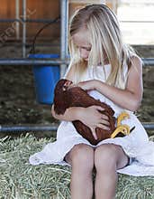 Young Girl holding Chicken