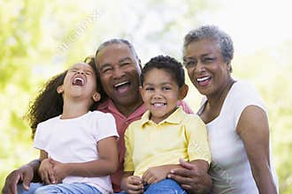 Grandparents laughing with grandchildren