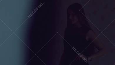 Slim model with long hair posing for a