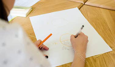 Woman drawing a chart