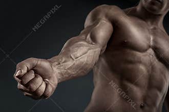 Close-up of athletic muscular arm and torso