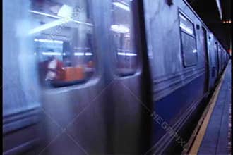 F train pulling out of New York City subway station