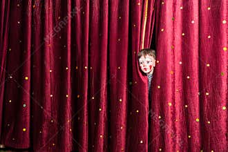 Little boy in makeup waiting for his acting cue