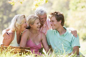 Parents with adult children on picnic