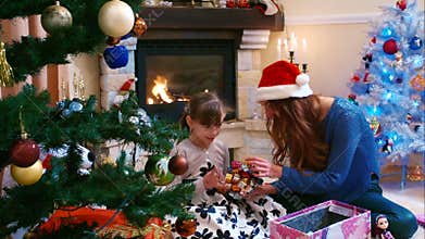 Sisters preparing to decorate the Christmas tree