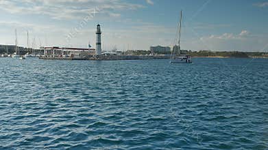 Sailing yacht motoring in the marina