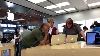 People buying new Macbook inside Apple store
