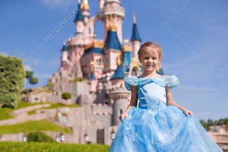 Little adorable girl in Cinderella dress at fairy