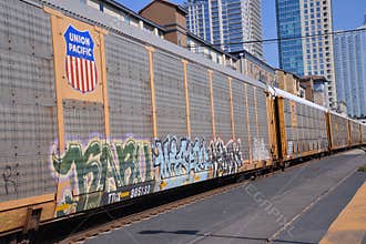 Train Passing with Downtown in the Background