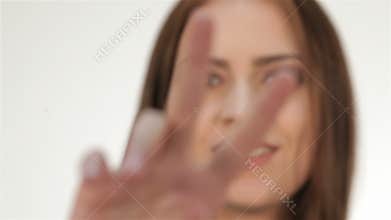 Cute teen girl showing peace gesture