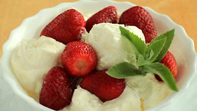 Dessert with strawberry ice cream and mint