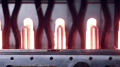 Producing PET bottles at factory.