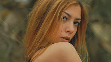 girl in dense forest video old dry branches outdoors slow motion