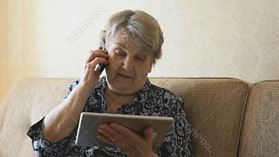 Grandma talking on a cell phone with a friend